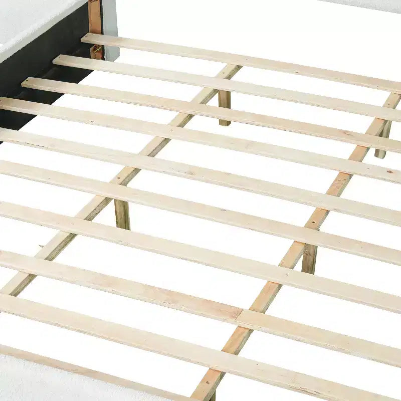 Estructura de cama moderna de madera tapizada en borreguito bouclé con cabecero curvo
